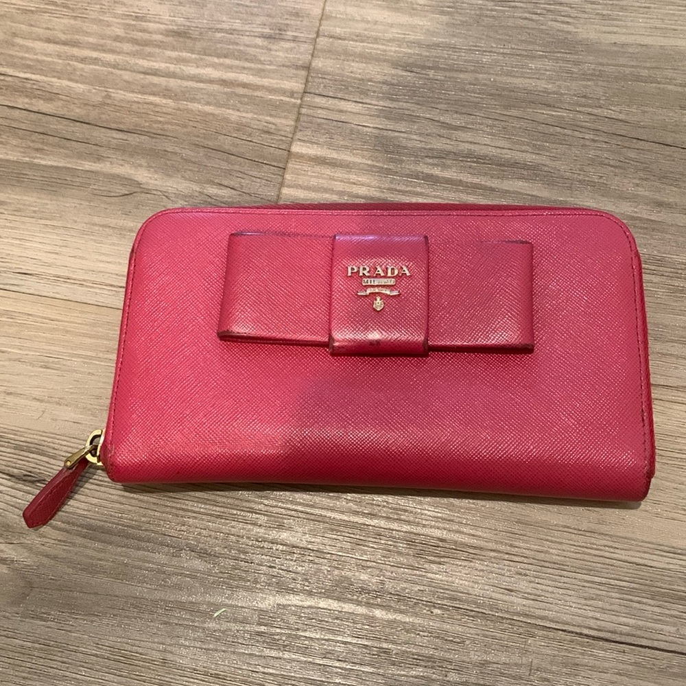 Prada hot pink zippy wallet with bow